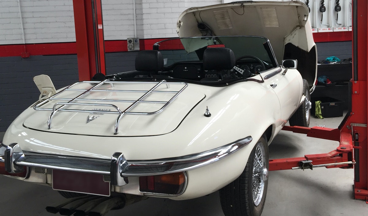 Rear view of the Jaguar ETYPE V12 Series 111 Roadster 1973 with fitted luggage rack that we had the pleasure to work on.